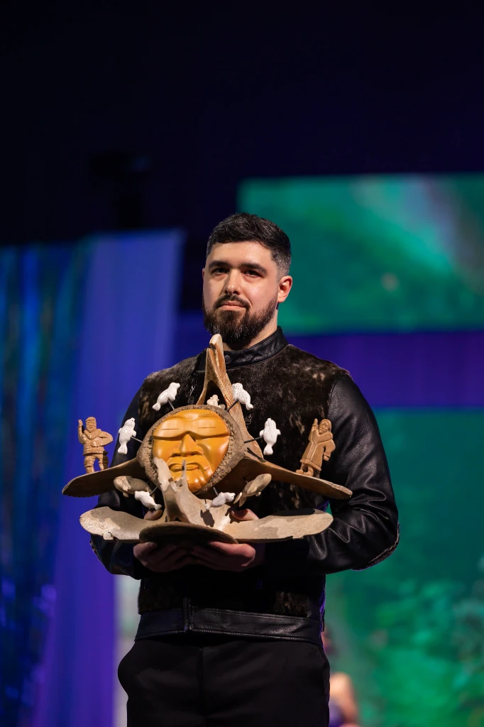 Mark Roseberry, a highly skilled professional and Iñupiaq scholar, serving as a Live Auction Model at the Ivalu Gala fundraiser supporting a North Slope non-profit organization